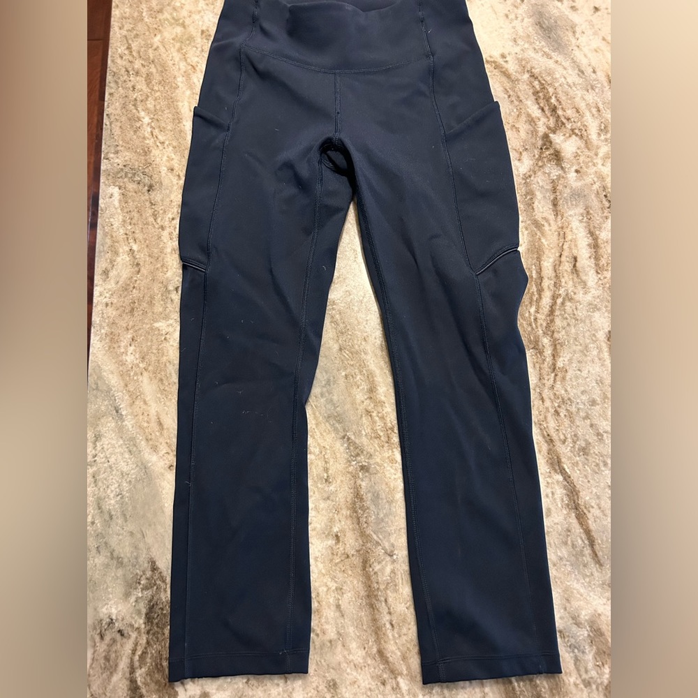 Navy Lululemon leggings. Size 2. Never worn by me (I mistook the size).